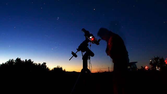 Looking at the night sky through a telescope